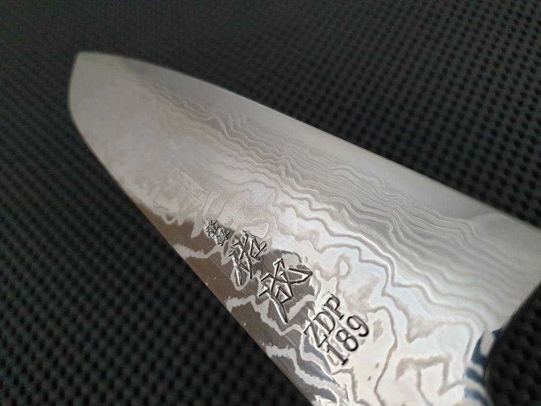 Sukenari ZDP Damascus | 195 Santoku Knife (Ebony) -w/Saya